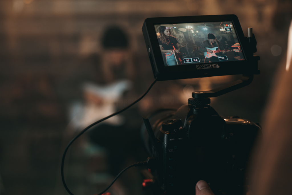 An image depicting the work process at Sprobuj Digital Agency, showcasing the video production setup during a concert, highlighting the agency's dedication to capturing and delivering creative content.