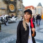 An image of the founder of UliTravel standing near Prague's astronomical clock