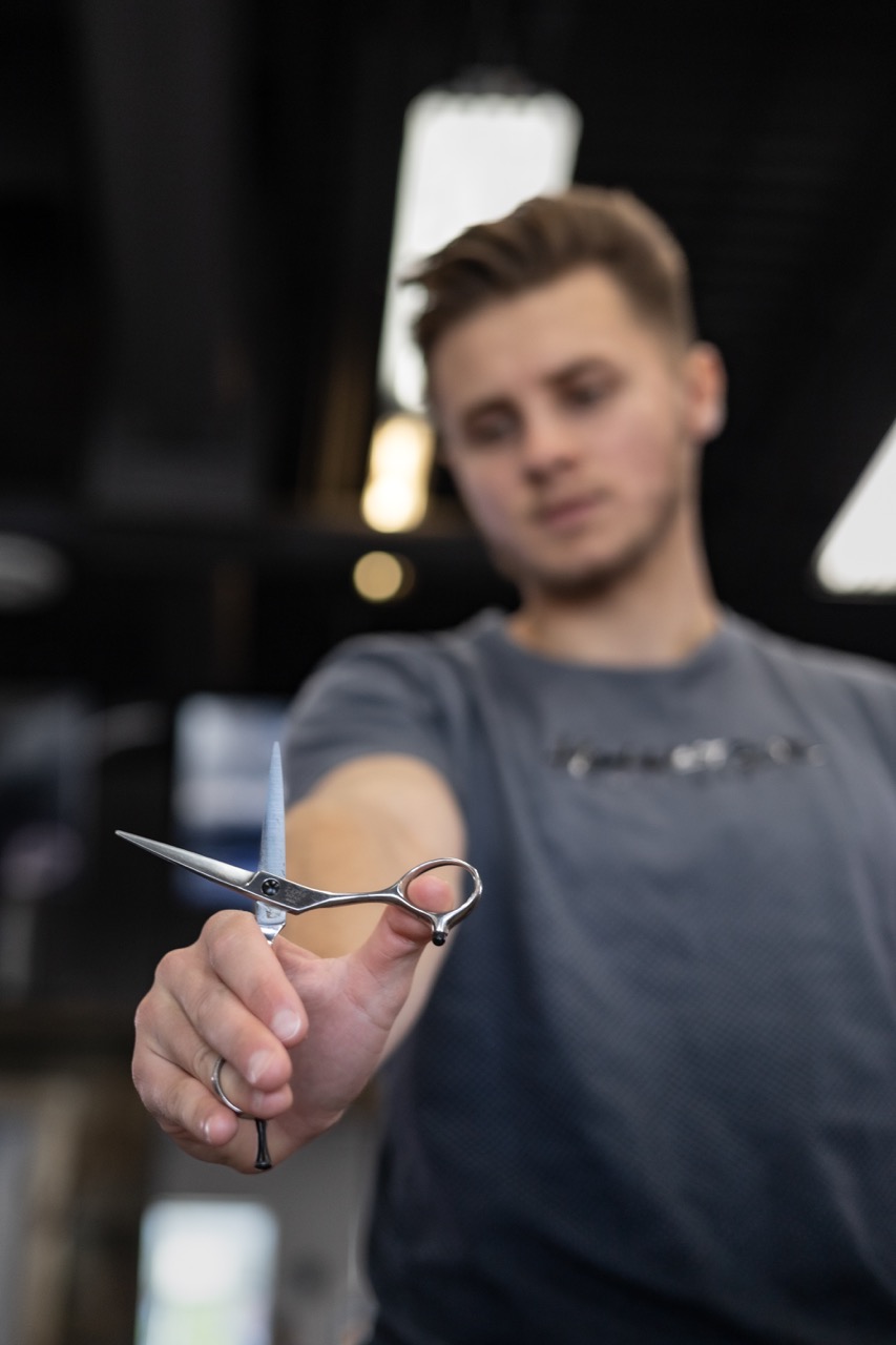 A captured moment from the branding-focused photoshoot orchestrated by Sprobuj Digital Agency for FiveStar Barbershop, emphasizing their unique brand identity and style.