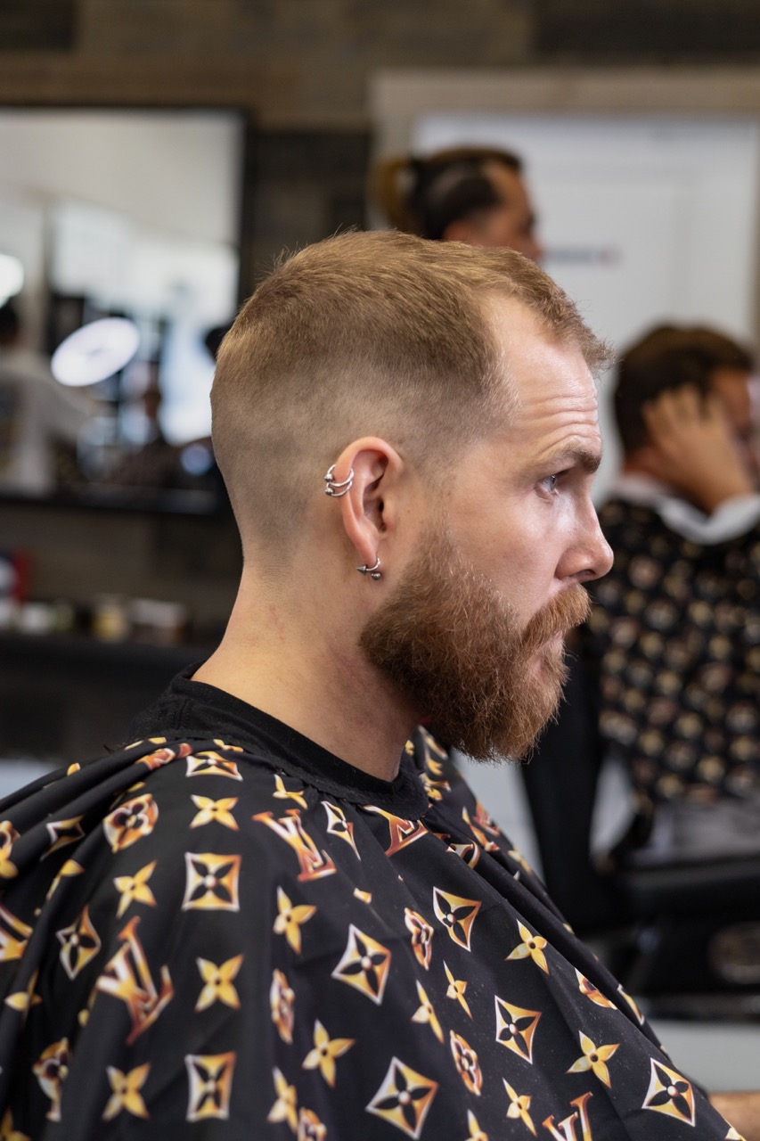A captured moment from the branding-focused photoshoot orchestrated by Sprobuj Digital Agency for FiveStar Barbershop, emphasizing their unique brand identity and style.