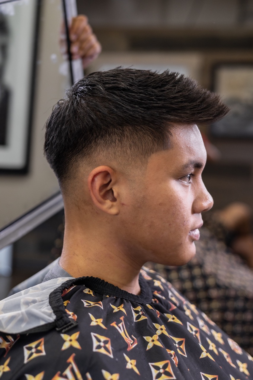 A captured moment from the branding-focused photoshoot orchestrated by Sprobuj Digital Agency for FiveStar Barbershop, emphasizing their unique brand identity and style.