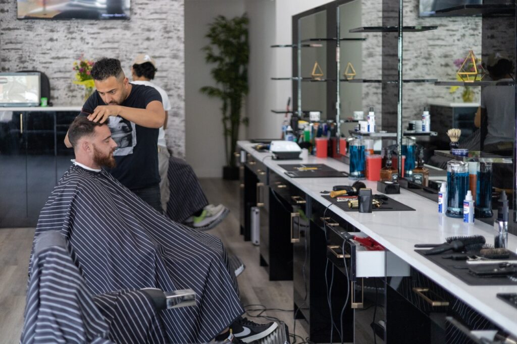 A snapshot from the photoshoot conducted by Sprobuj Digital Agency to commemorate the opening of FiveStar Barbershop's new location, capturing the excitement and energy of the event.