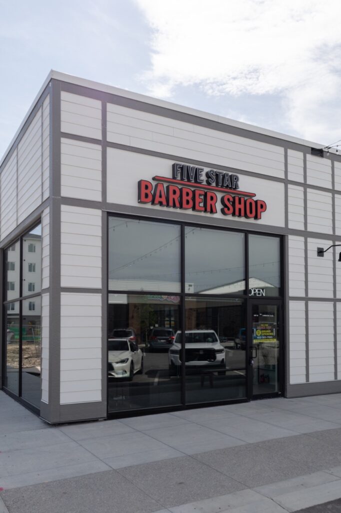 A snapshot from the photoshoot conducted by Sprobuj Digital Agency to commemorate the opening of FiveStar Barbershop's new location, capturing the excitement and energy of the event.