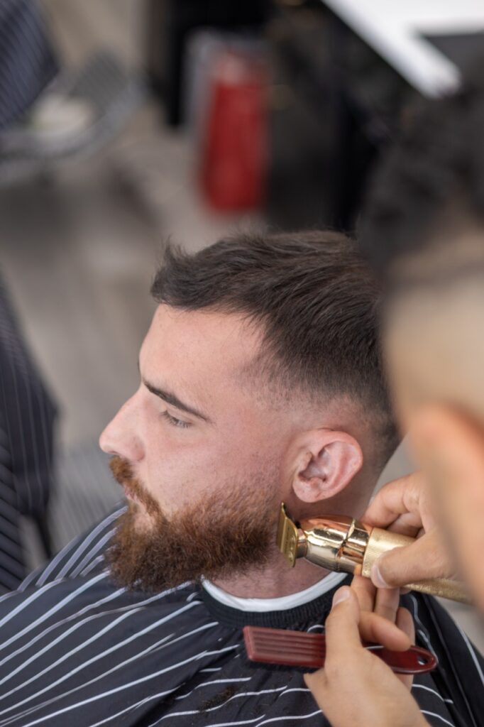 A snapshot from the photoshoot conducted by Sprobuj Digital Agency to commemorate the opening of FiveStar Barbershop's new location, capturing the excitement and energy of the event.