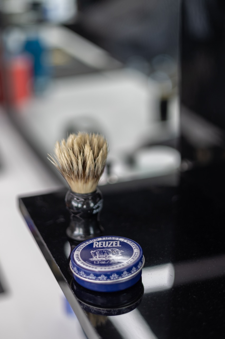 A snapshot from the photoshoot conducted by Sprobuj Digital Agency to commemorate the opening of FiveStar Barbershop's new location, capturing the excitement and energy of the event.