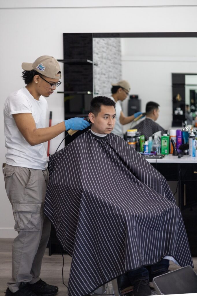 A snapshot from the photoshoot conducted by Sprobuj Digital Agency to commemorate the opening of FiveStar Barbershop's new location, capturing the excitement and energy of the event.
