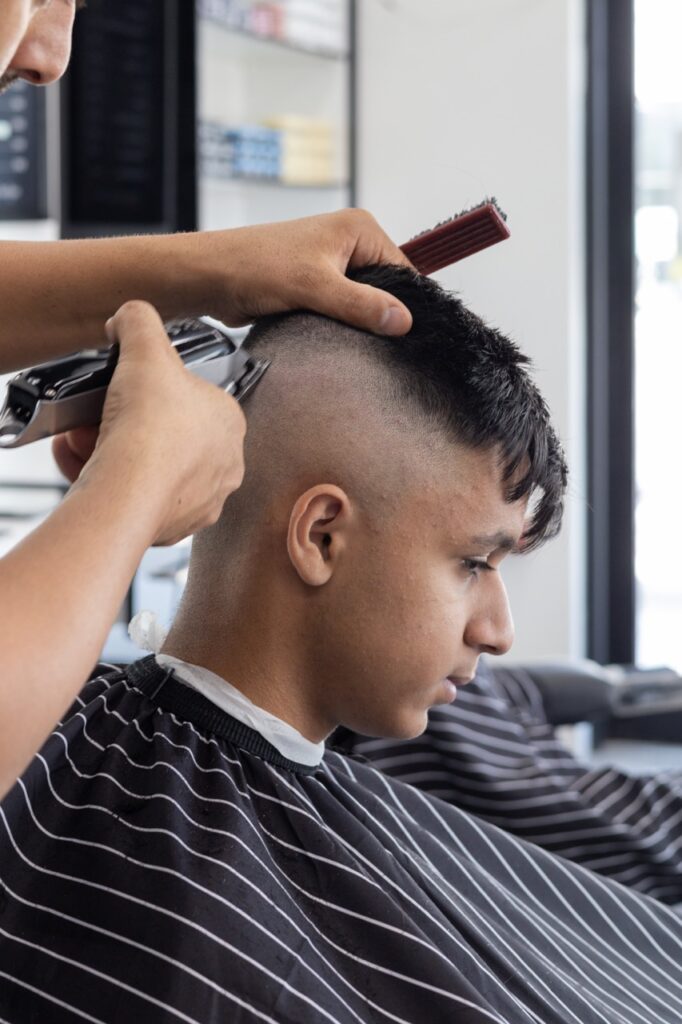 A snapshot from the photoshoot conducted by Sprobuj Digital Agency to commemorate the opening of FiveStar Barbershop's new location, capturing the excitement and energy of the event.