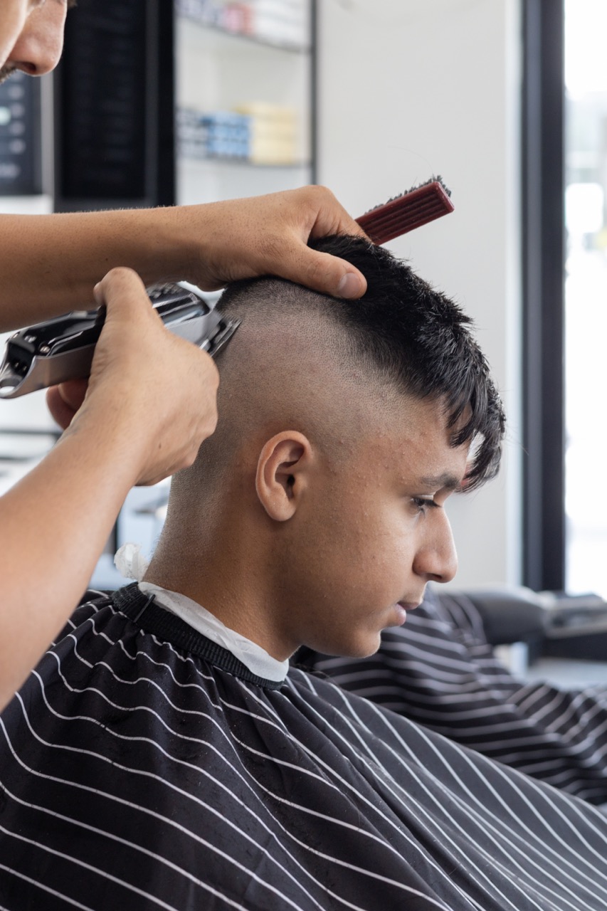 A snapshot from the photoshoot conducted by Sprobuj Digital Agency to commemorate the opening of FiveStar Barbershop's new location, capturing the excitement and energy of the event.
