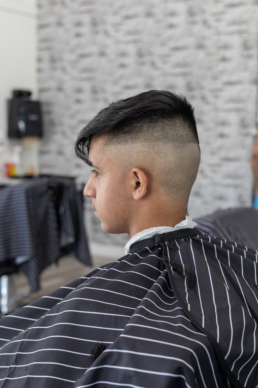 A snapshot from the photoshoot conducted by Sprobuj Digital Agency to commemorate the opening of FiveStar Barbershop's new location, capturing the excitement and energy of the event.