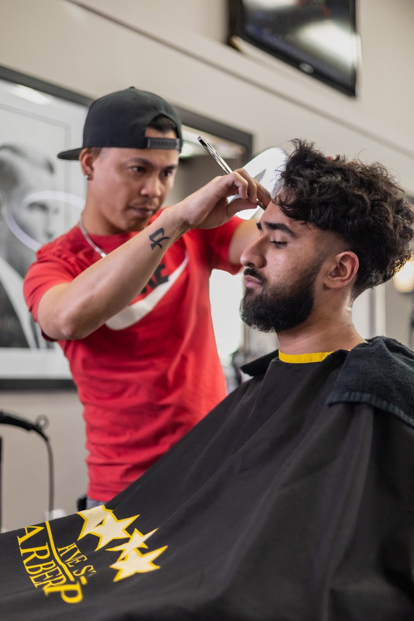 A captured moment from the branding-focused photoshoot orchestrated by Sprobuj Digital Agency for FiveStar Barbershop, emphasizing their unique brand identity and style.