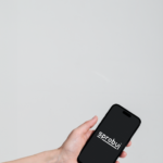 The main photo for mobile adaptation featuring a phone with the Sprobuj Digital Agency logo.
