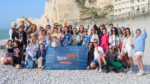 A main image for the WowTrip Tours case study, featuring tourists standing with the WowTrip Tours flag, encapsulating the essence of the journey and success achieved in collaboration with Sprobuj Digital Agency.